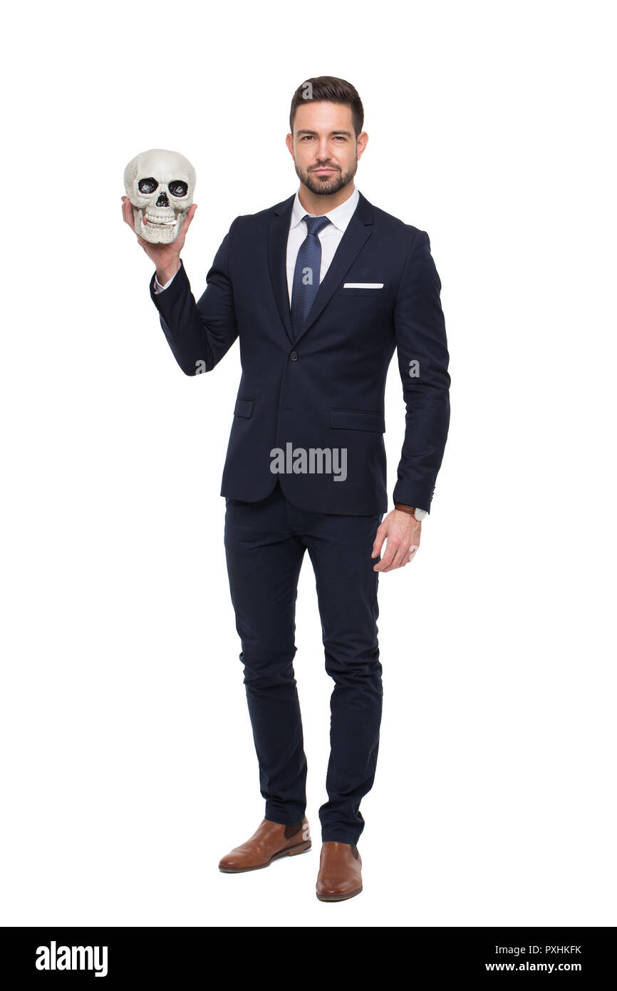 Confident businessman holding skull, business competition, isolated on white Stock Photo