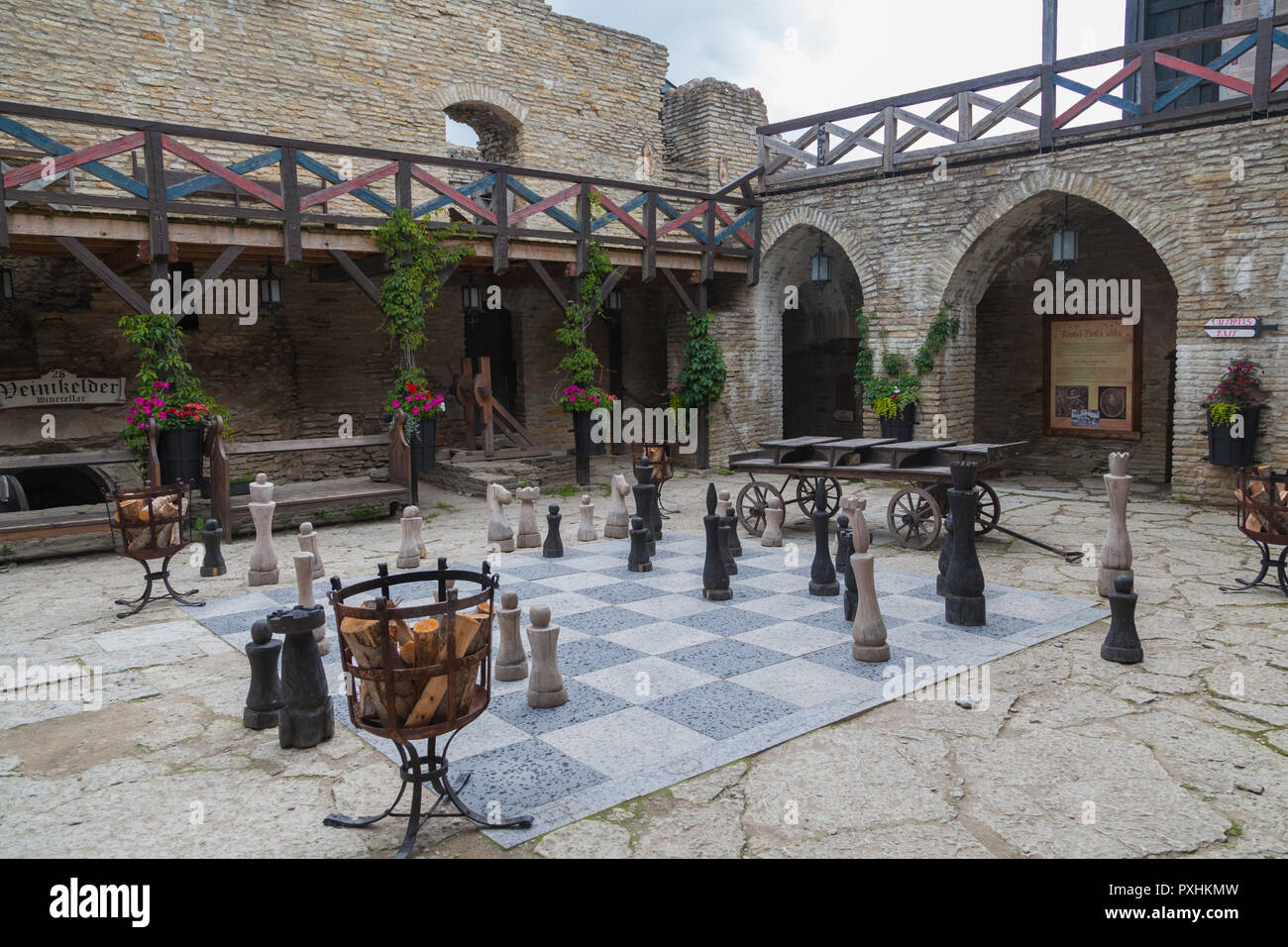 Inner courtyard with large chess in the medieval fortress of Rakvere, Estonia, July 5, 2018 Stock Photo