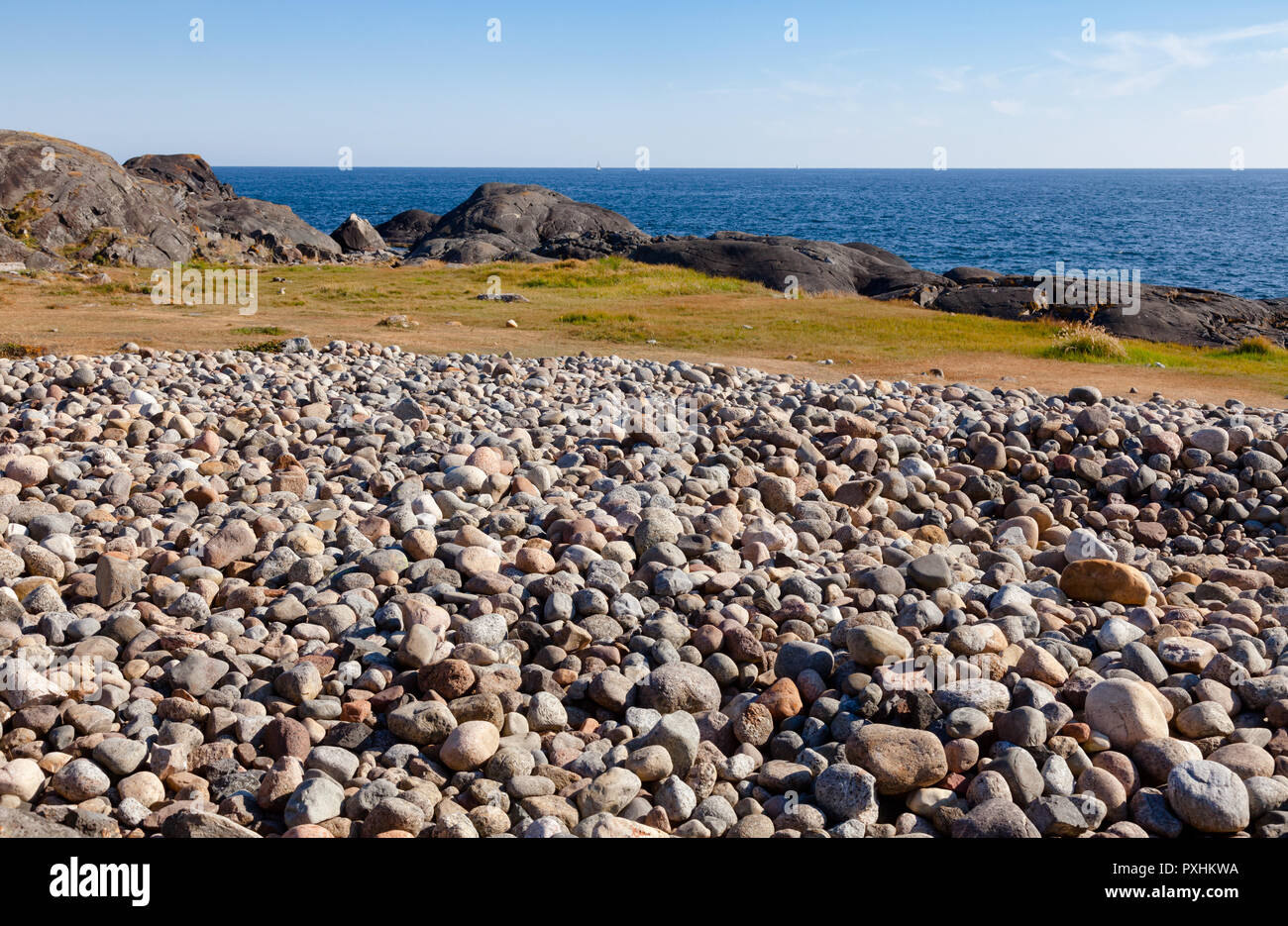 Cobble deposit from the recent ice age or beach of rolling stones at Molen, first UNESCO Global Geopark in the Nordic Countries near Larvik, Vestfold  Stock Photo