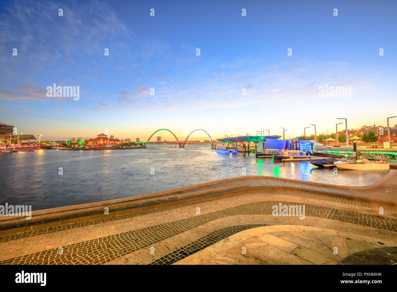 Elizabeth Quay Marina with docked boats and sunset light. Perth ...