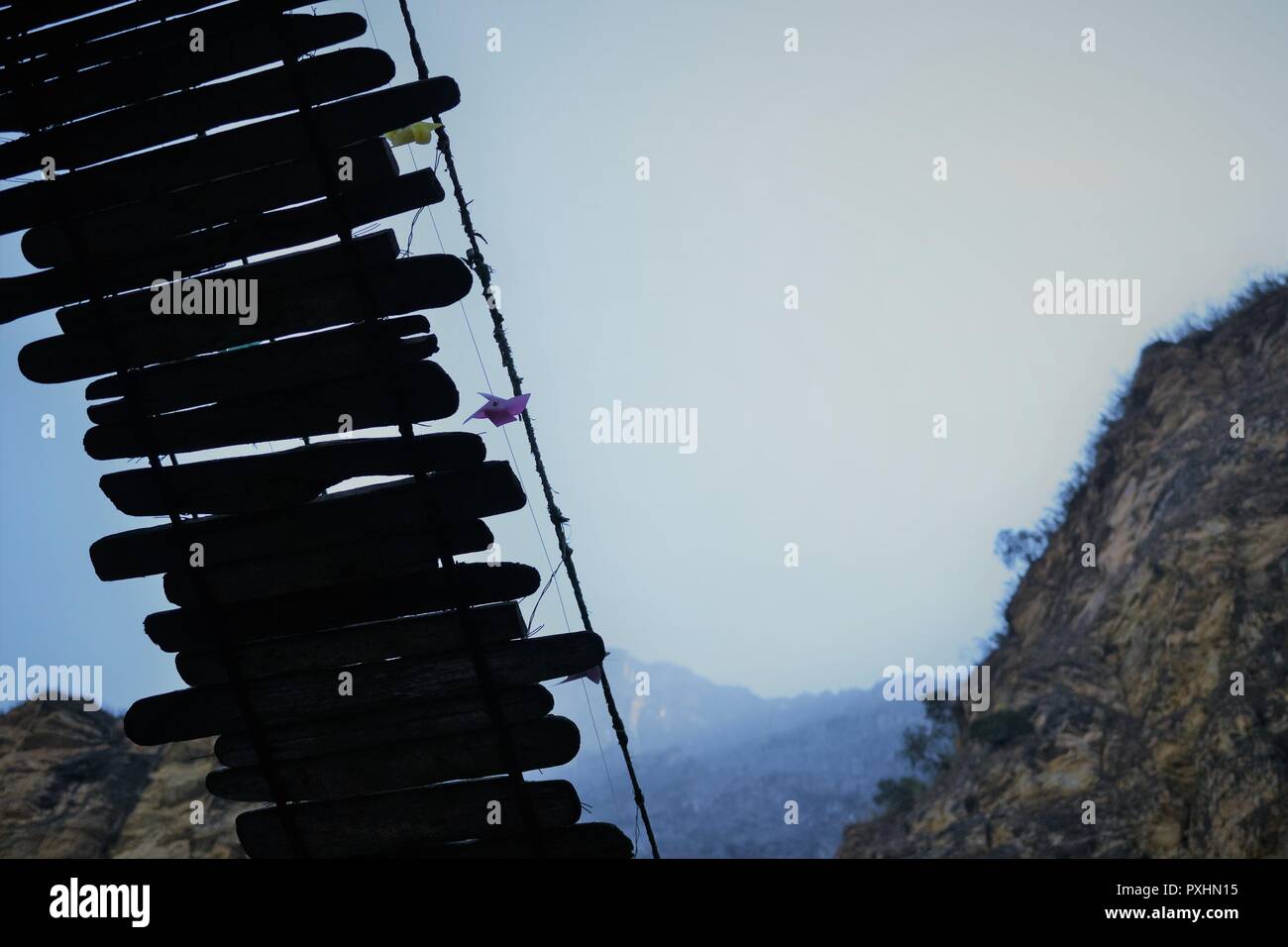 wooden bridge in Tiger Leaping Mountains and river. north