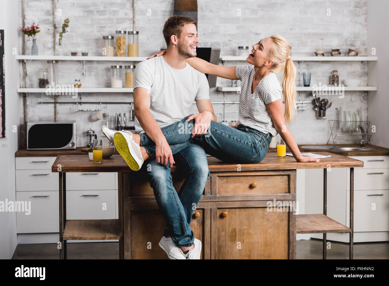 Laughing man sitting counter hi-res stock photography and images - Alamy
