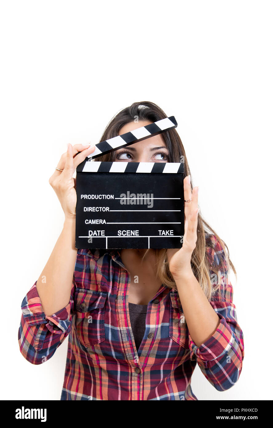 Waist up portrait of young beautiful woman holding film slate and looking at camera on white background Stock Photo