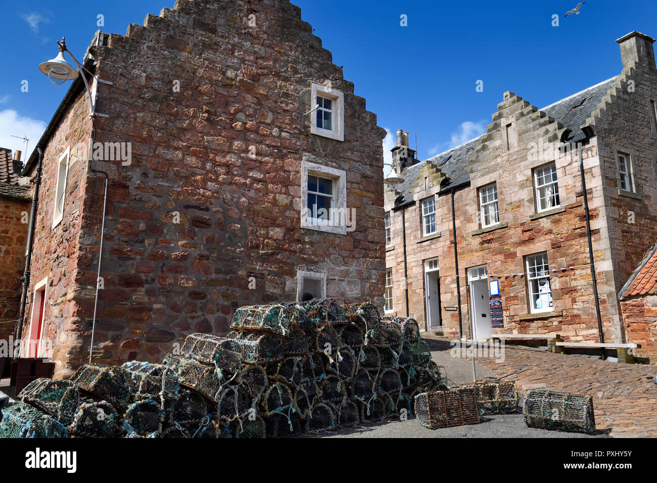 Brodie's Grannie's restaurant and stone houses and lobster traps in the fishing village of Crail Fife Scotland UK Stock Photo