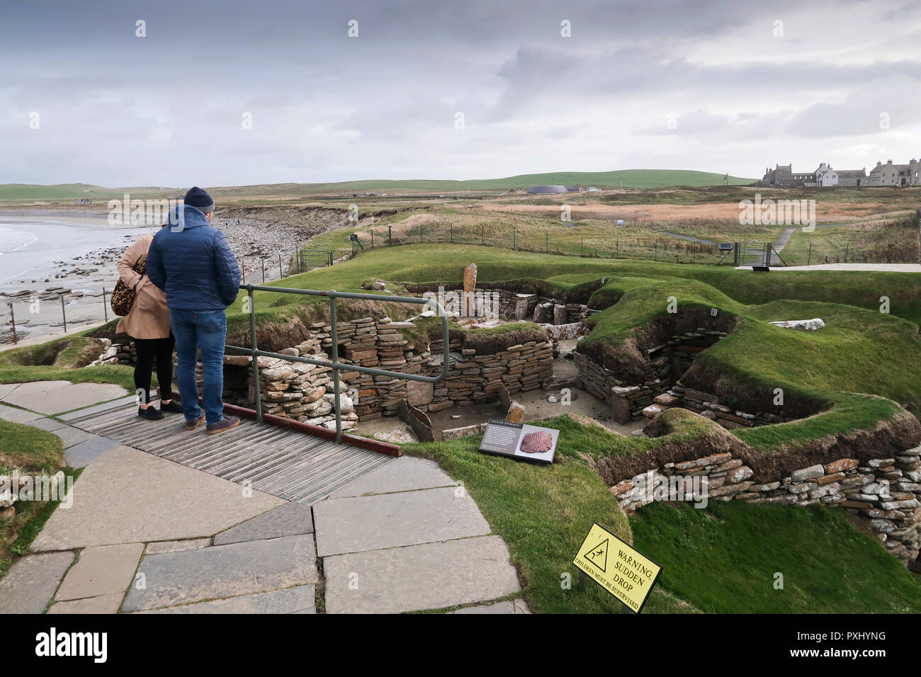 Visitors at Skara Brae historical site Orkney Stock Photo