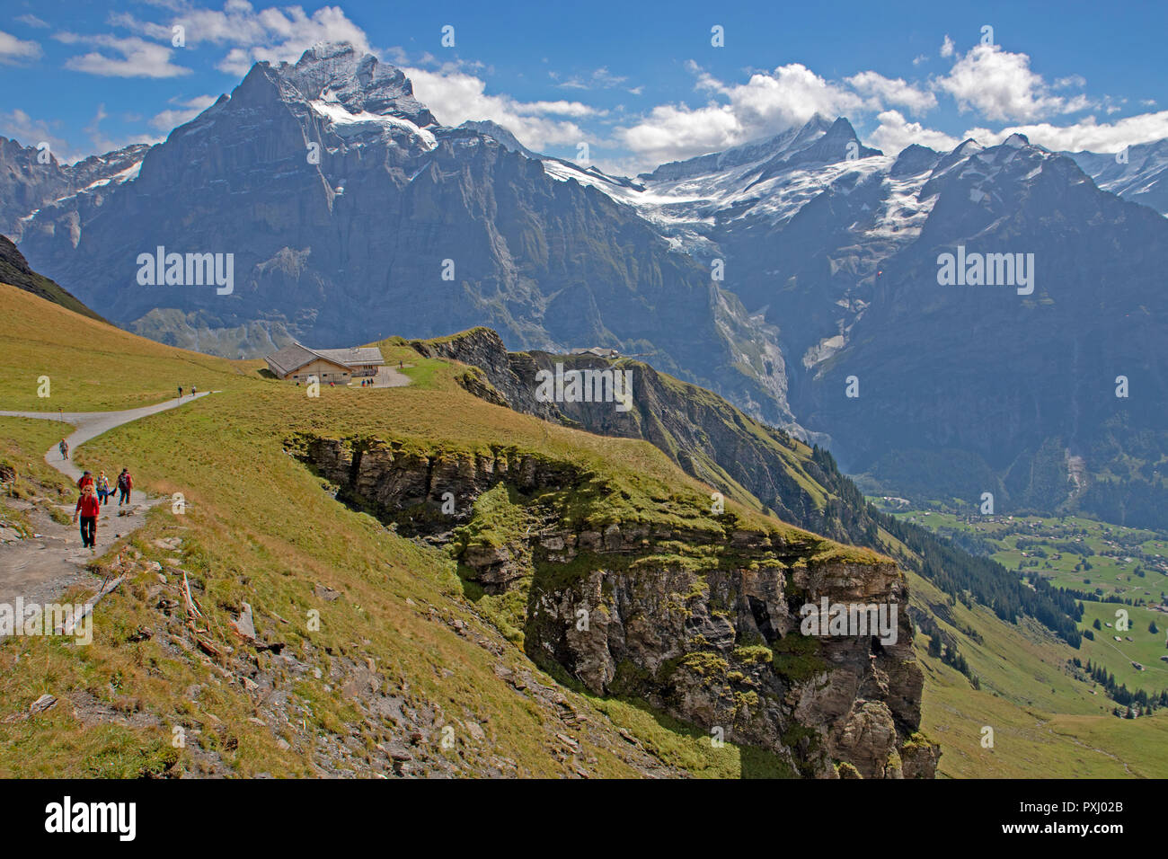 Hikers on the trail to Bachalpsee above Grindelwald Stock Photo