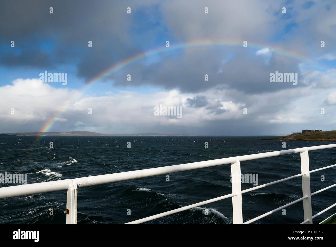 Rainbow over Scapa Flow Orkney Islands from Flotta ferry Stock Photo