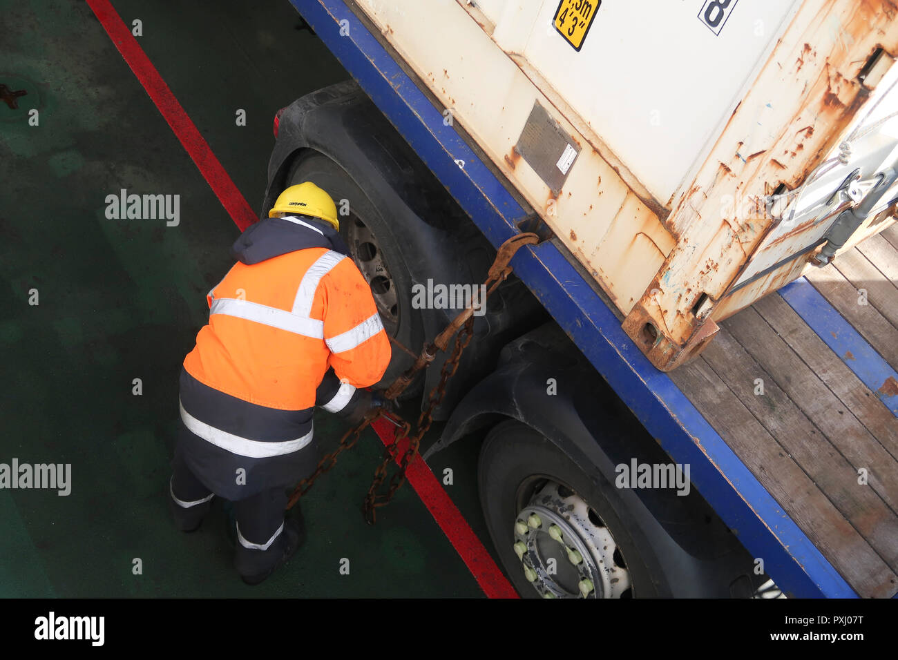 Deckhand securing HGV on ferry Stock Photo Alamy