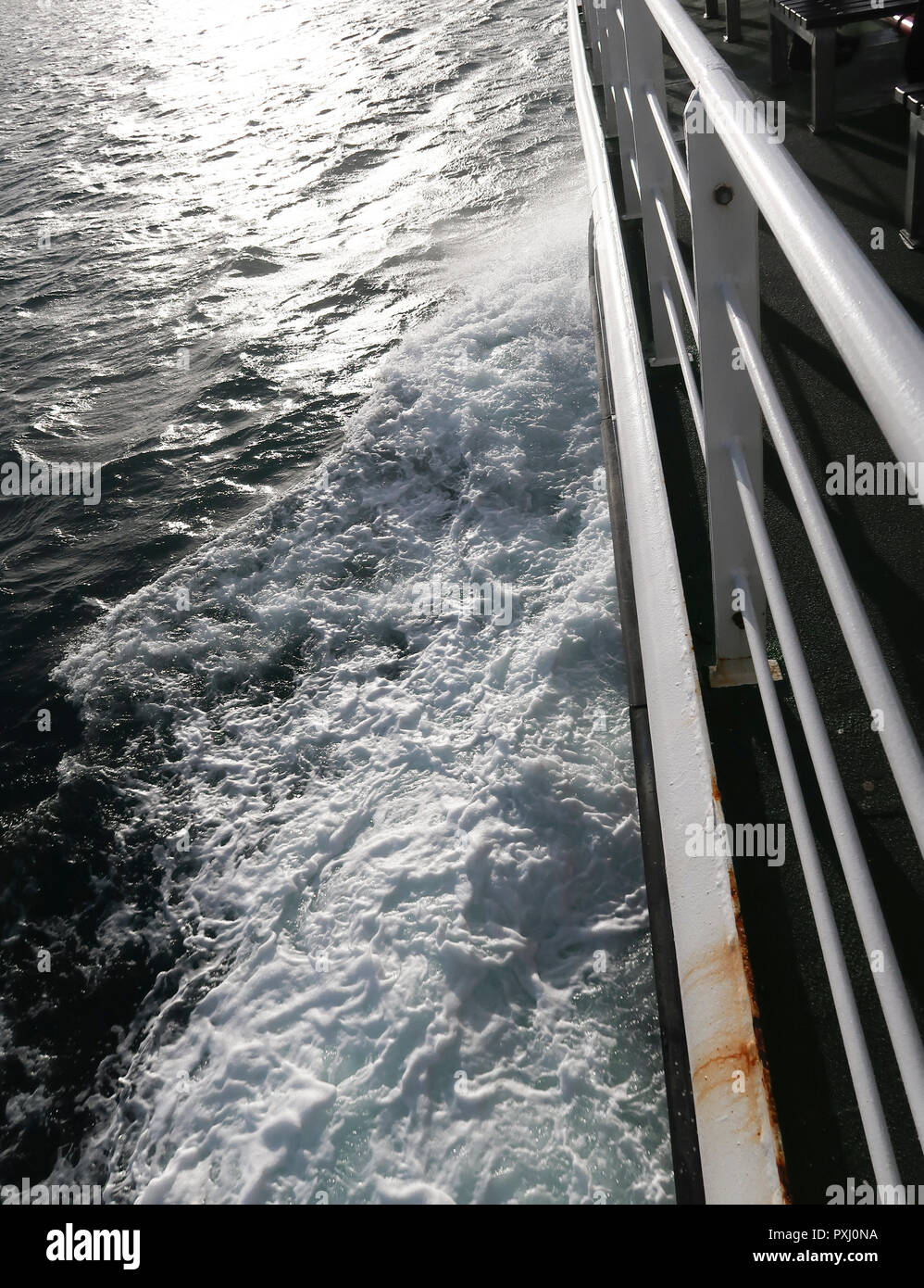 Wash to side of boat on sea Stock Photo Alamy
