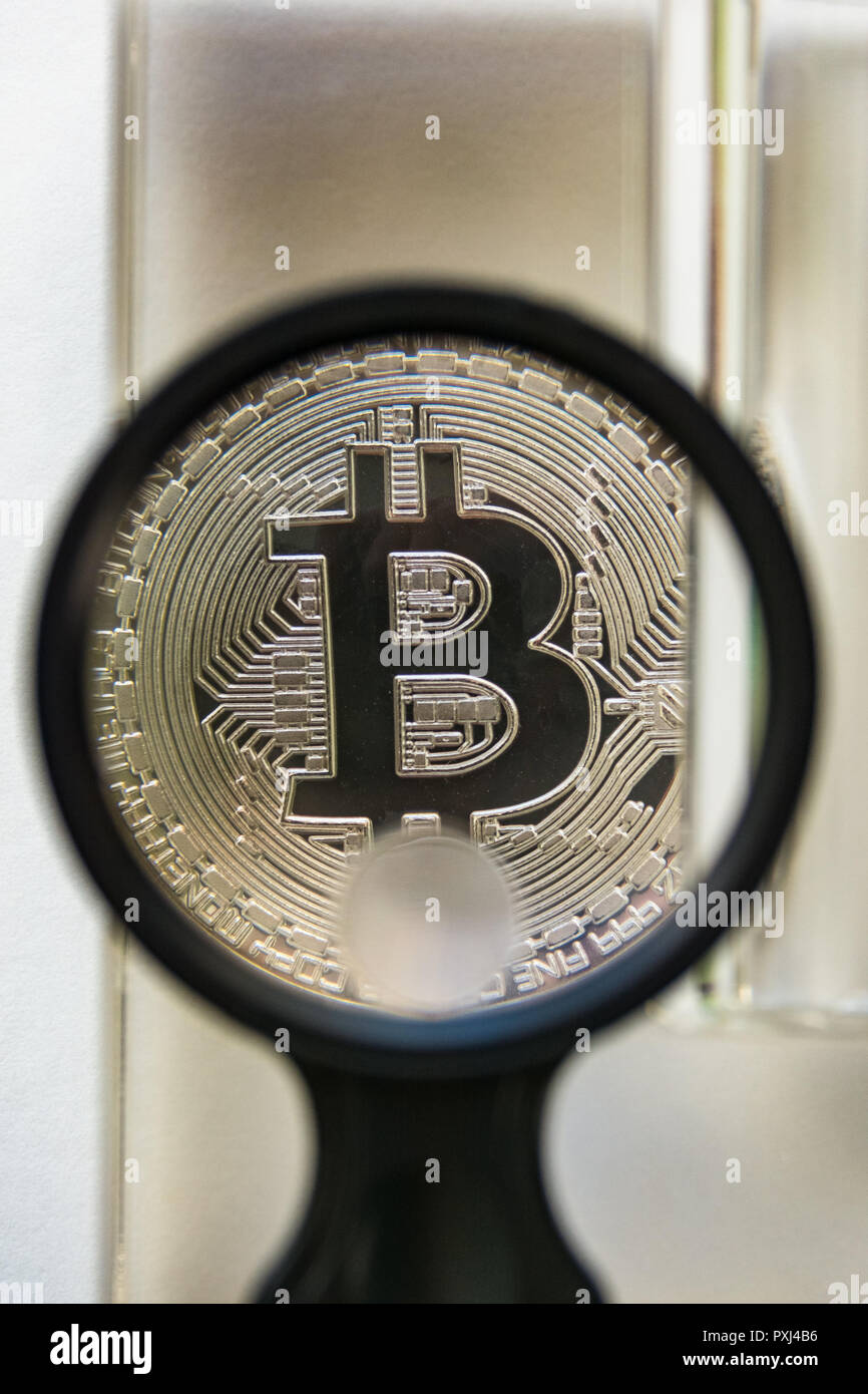 Bitcoin metal crypto coin under glass prism and magnifying glass Stock  Photo - Alamy