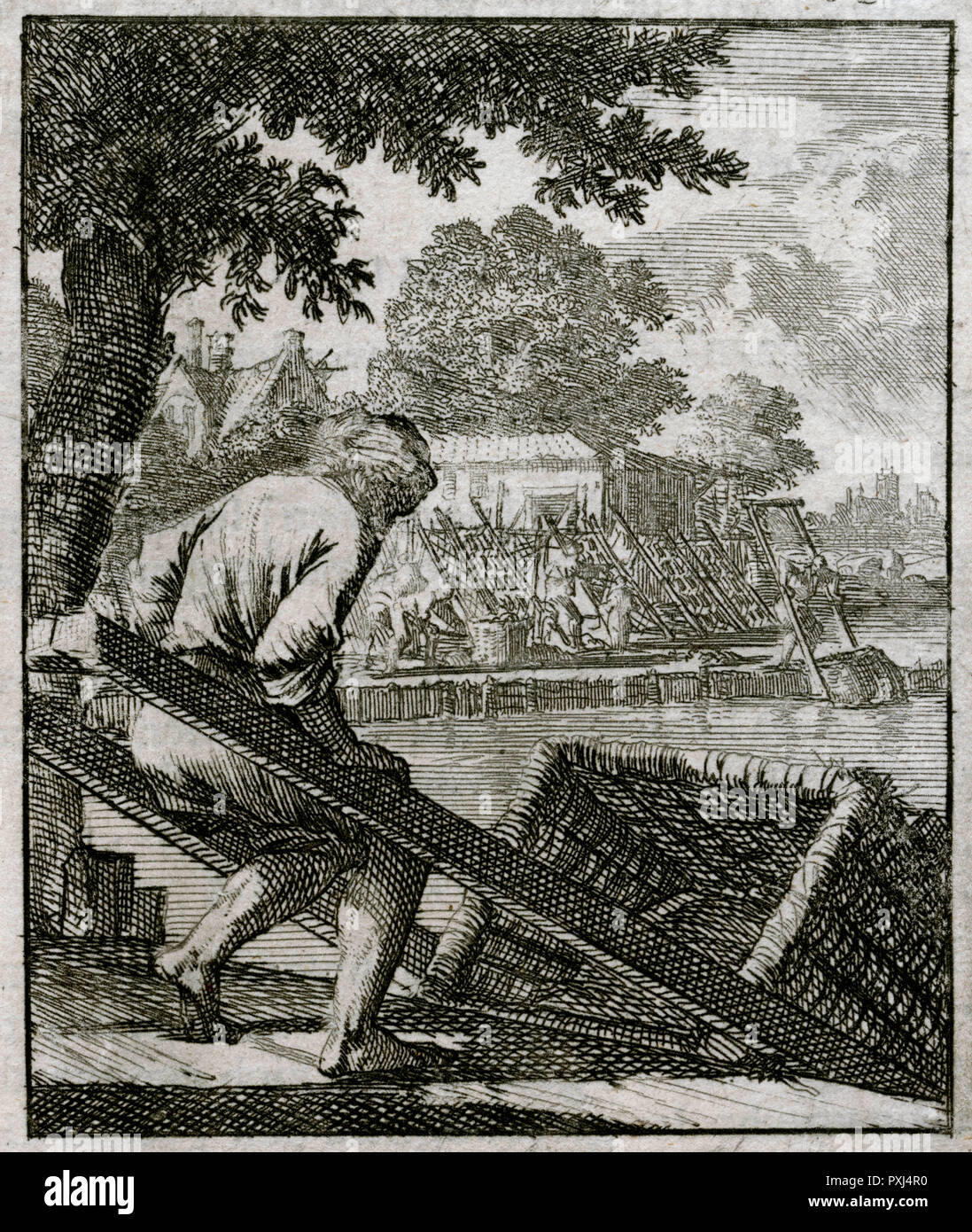 A Dutch basketmaker lowers a large basket into the river, a stage in