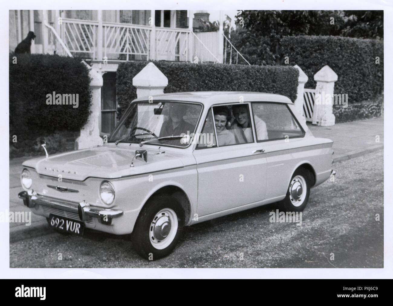 A family out for a drive in their new Hillman Imp Stock Photo