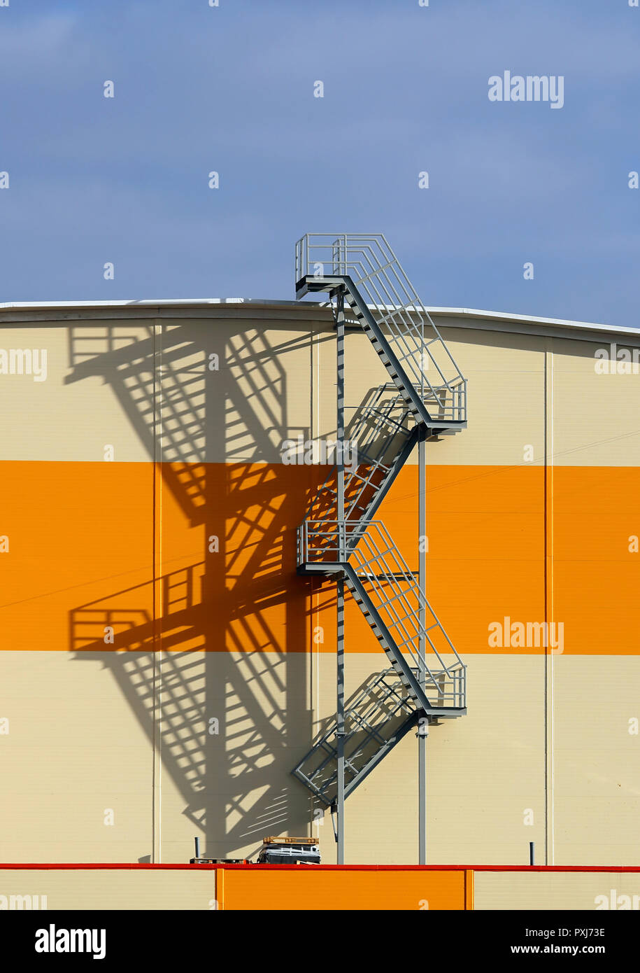 Multi-span metal staircase at the outside of the industrial building Stock Photo