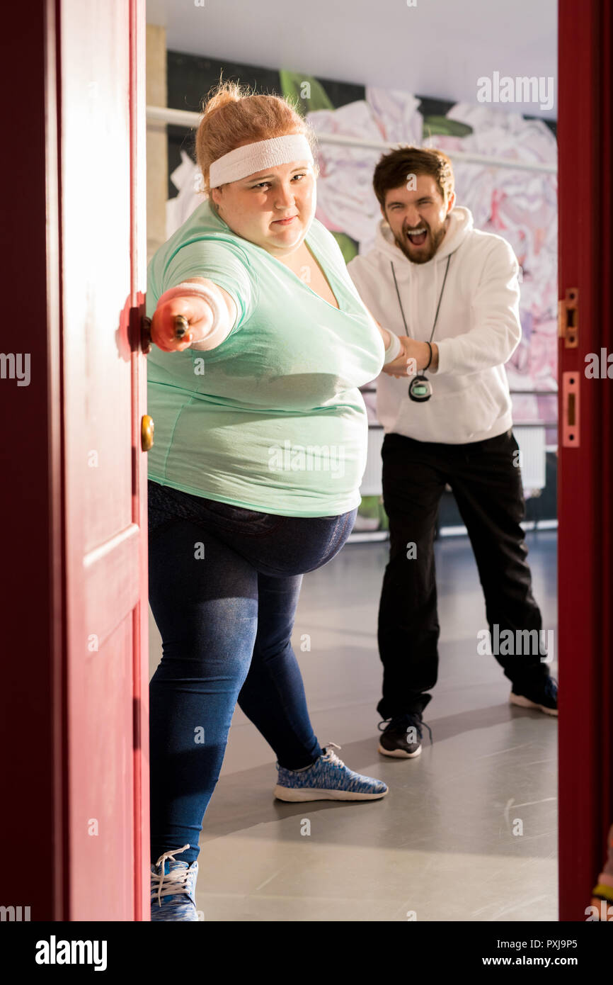 Fat Woman Escaping Training Stock Photo