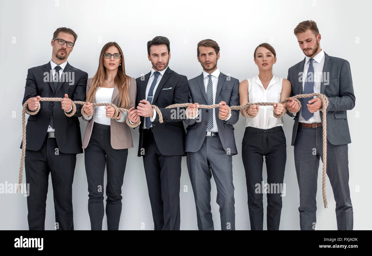 group of young people tied with a strong rope .photo with copy space ...