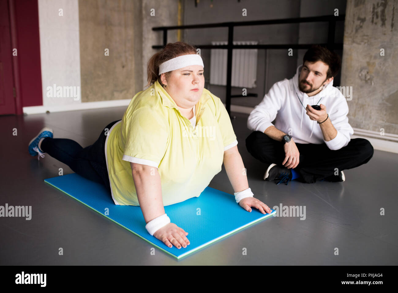 Overweight Young Woman Doing Sports Stock Photo