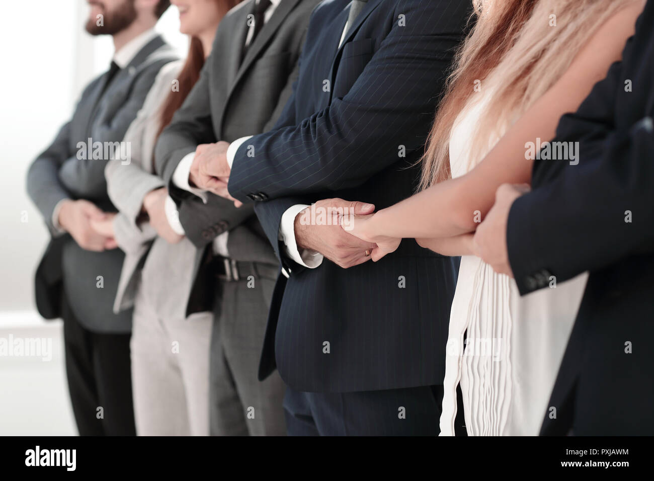 close up.serious business team standing together Stock Photo - Alamy