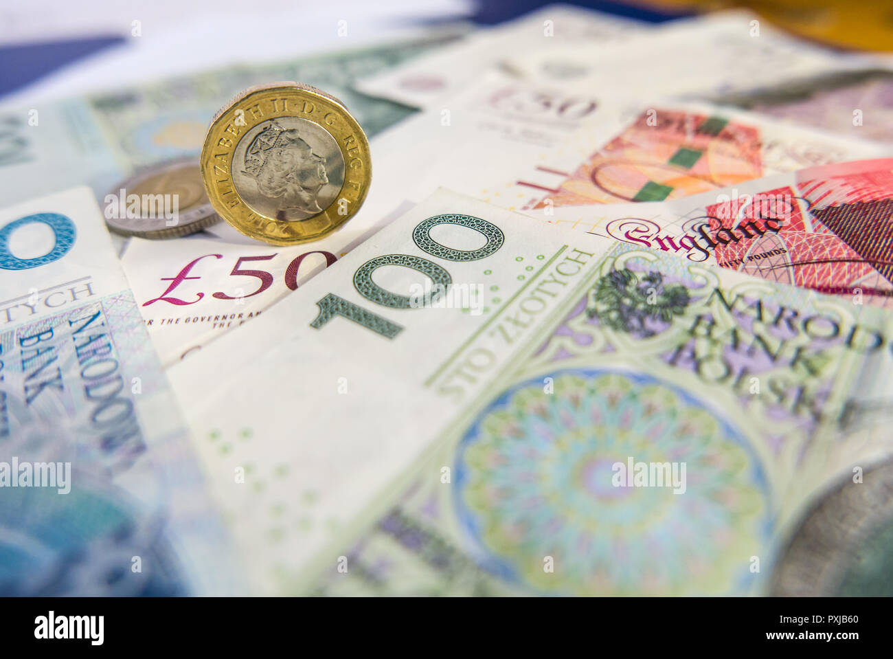 One British pound and Polish zloty coin and notes Stock Photo Alamy