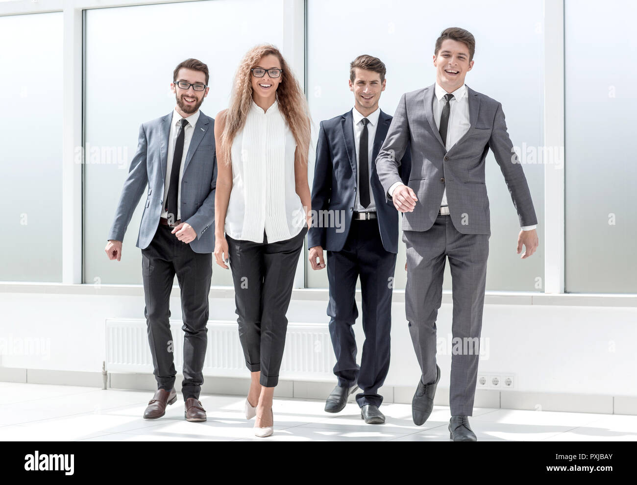 group of business people walking together Stock Photo - Alamy
