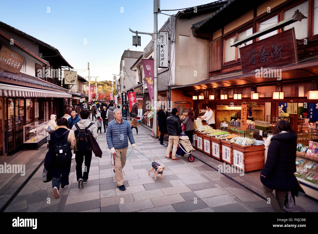 People walking on Byodo-in Omotesando street with multiple tea stores in the city of Uji, Japanese capital of tea, Kyoto prefecture, Japan 2017 Stock Photo