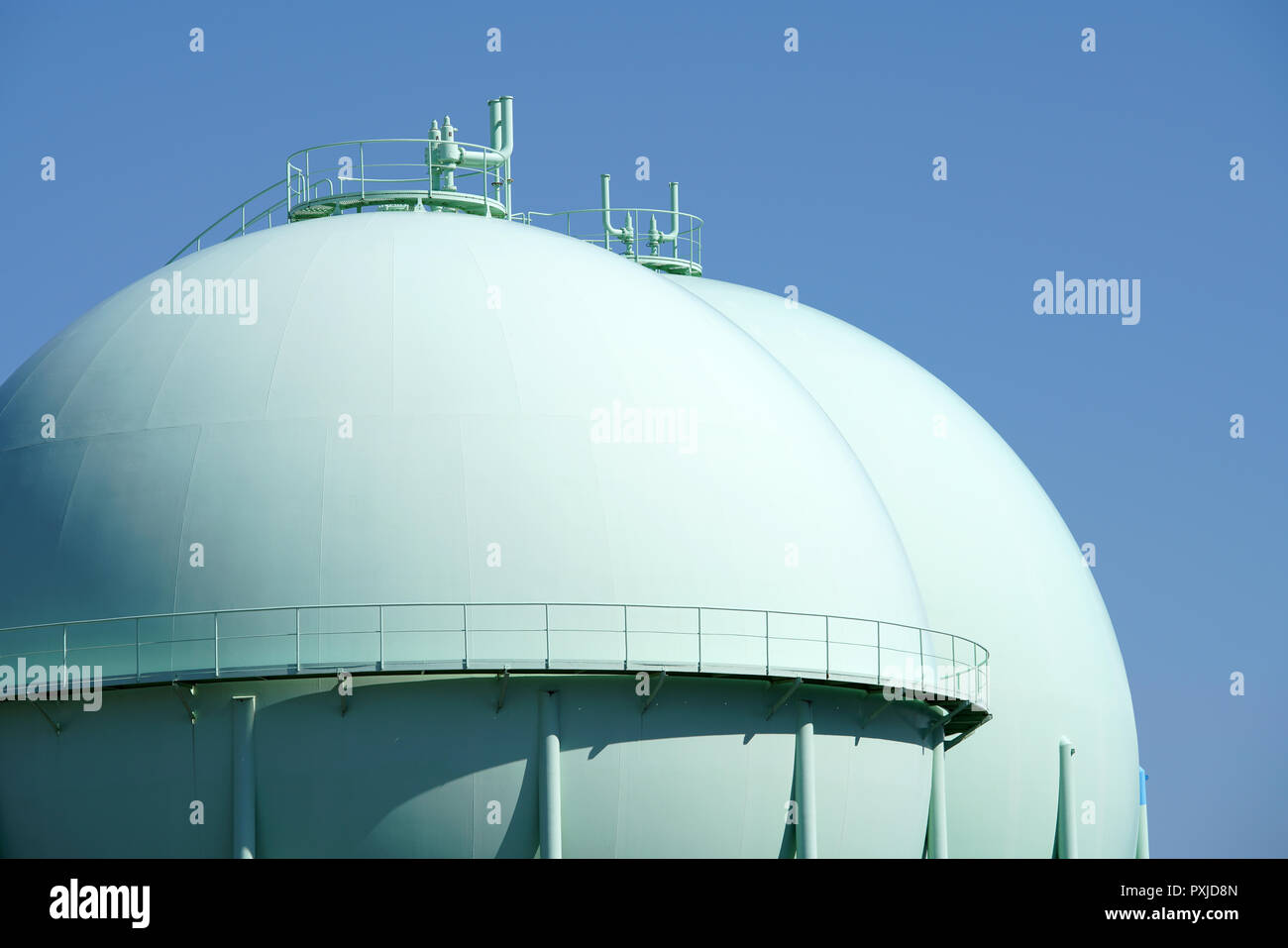 Sphere gas tanks in petrochemical plant against the blue sky Stock Photo