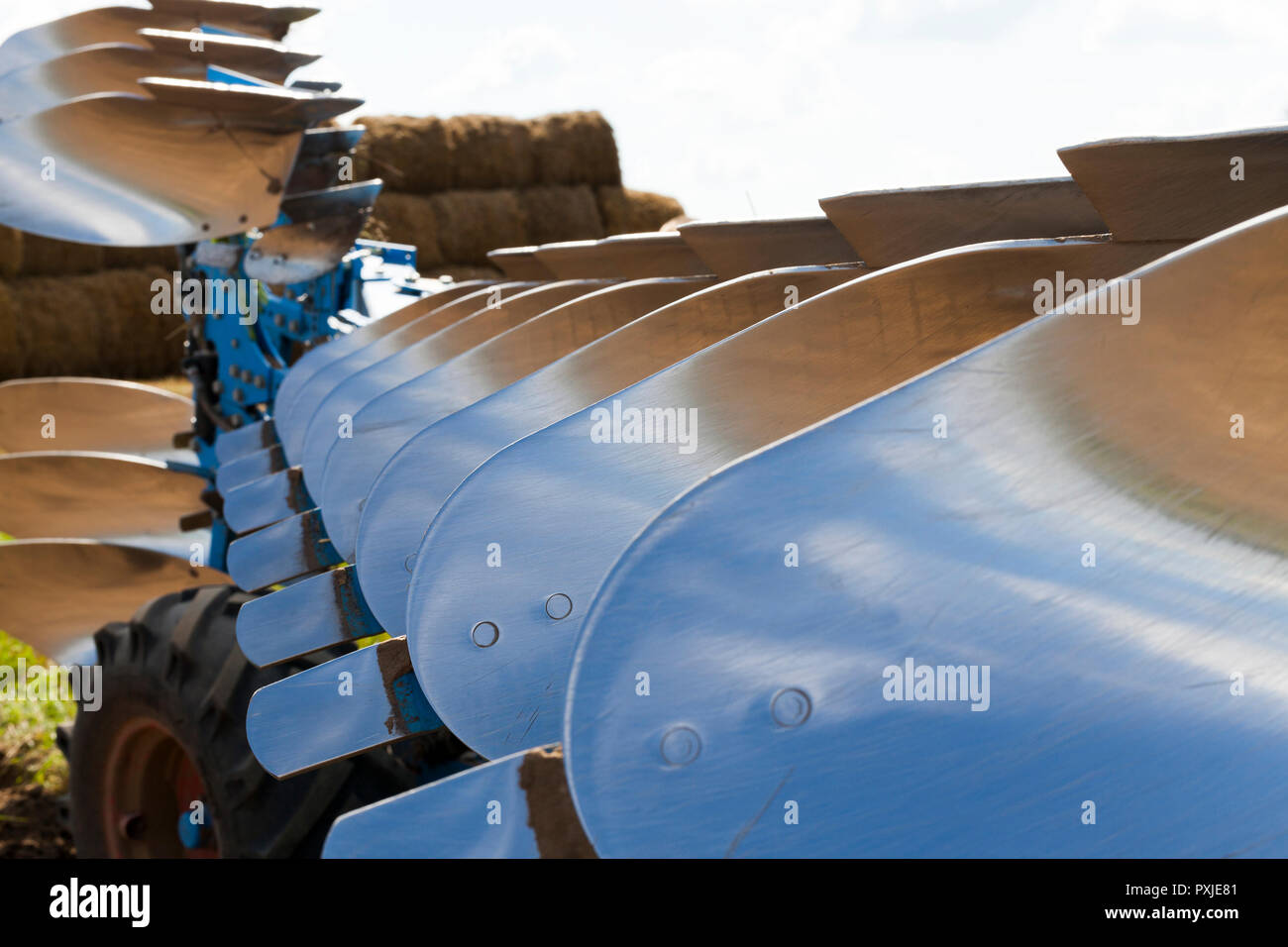 polished blade of the plow from frequent tillage, close-up of the plow ...