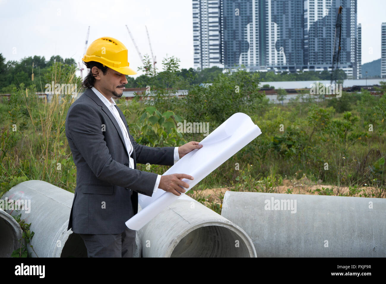 arab engineer with blueprints Stock Photo Alamy