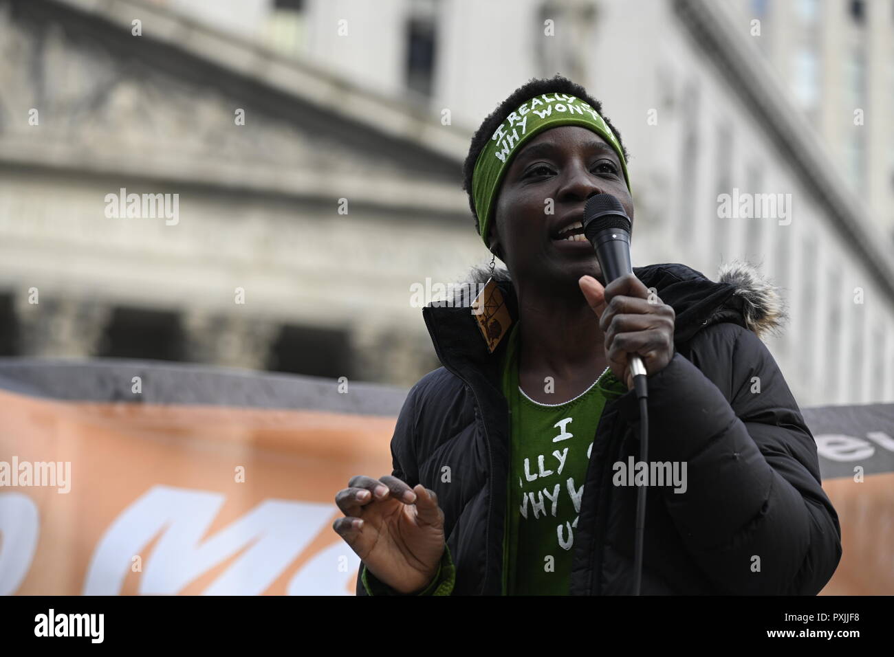 New York, USA, 22nd Oct, 2018.  Patricia Okoumou speaks at a rally against police brutality at  Foley Square in lower Manhattan.  It was one of dozens of similar events scheduled in cities across the U.S. to mark the 23rd Annual National Day of Protest to Stop Police Brutality, founded in 1996 by the October 22 Coalition. Okoumou, a Congo native, faces trial on Dec 17 on trespassing and other charges after she climbed the pedestal of the Statue of Liberty on July 4, 2018, to protest Trump administration immigration policies. Credit: Joseph Reid/Alamy Live News Stock Photo