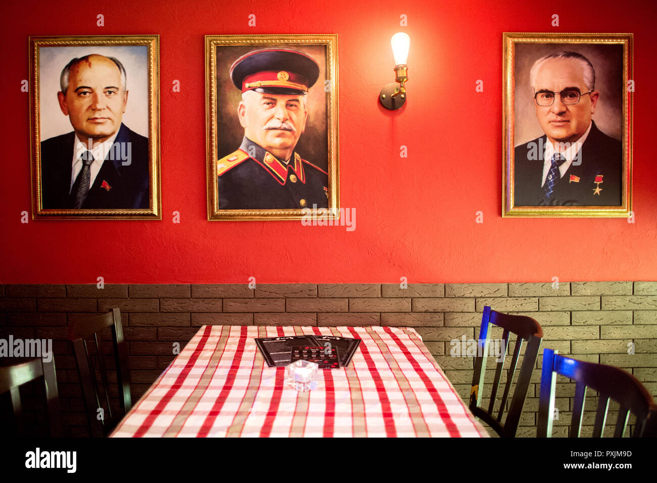 Hanover, Germany. 07th Apr, 2018. The portraits of former Soviet politicians Mikhail Gorbachev (l-r), Josef Stalin and Yuri Andropov hang in the KGB bar. With many Soviet relics, the bar in the city centre of Hanover is reminiscent of the former USSR. Credit: Hauke-Christian Dittrich/dpa/Alamy Live News Stock Photo