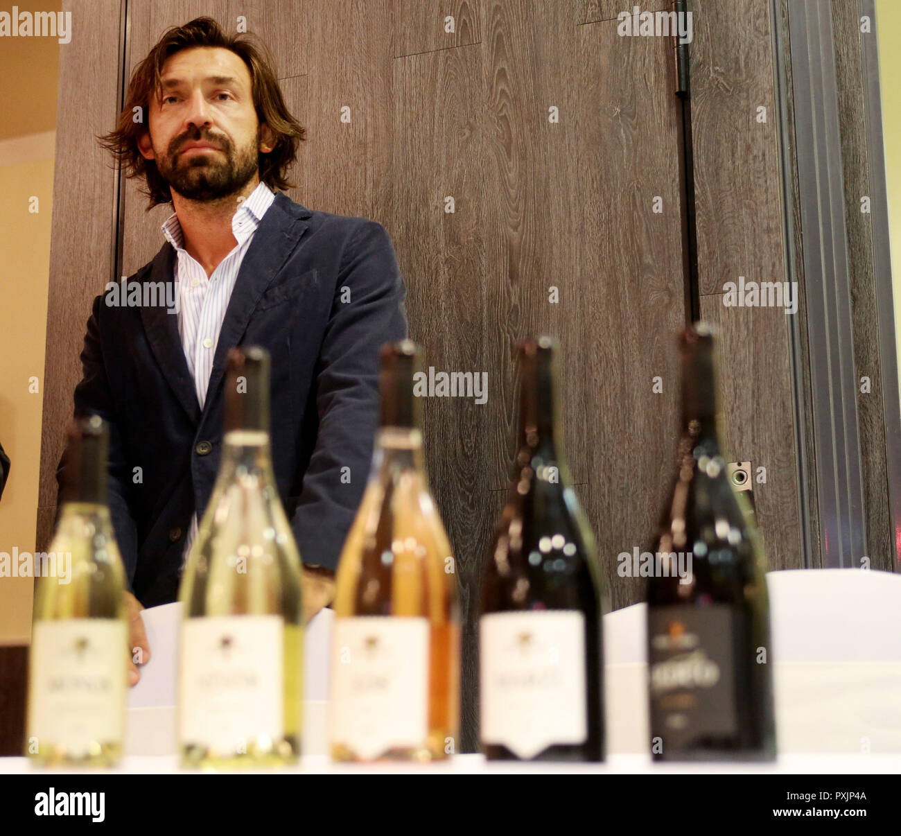 Duisburg, Germany. 22nd Oct, 2018. Andrea Pirlo, soccer world champion 2006 with Italy, stands at a wine presentation in a hotel. Last year he ended his career. Now the Pirlo is a winemaker. And presents his wines in the Italian World Cup quarter of 2006. (to dpa message: 'Drinking wine finally allowed: World Champion Pirlo is winegrower today' from 23.10.2018) Credit: Roland Weihrauch/dpa/Alamy Live News Stock Photo