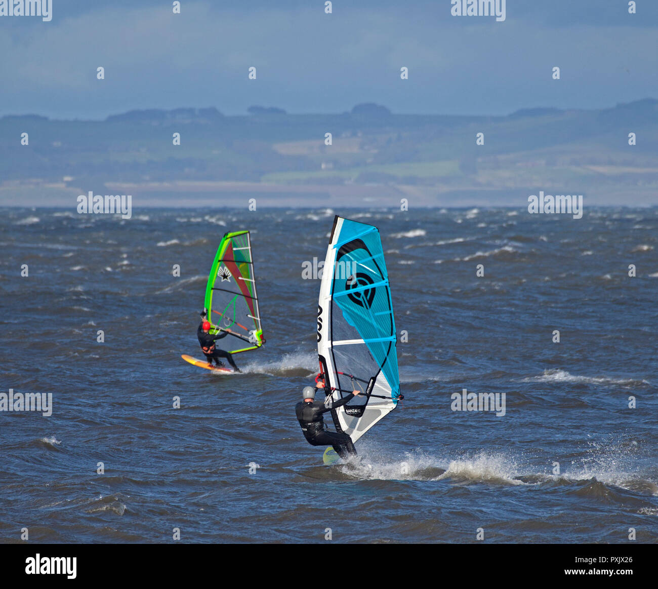 Gullane, East Lothian, Scotland, UK, 23 Oct. 2018 UK weather, 14 degrees with sunshine and winds of 44km/h and gusts of 57 km/h, windsurfers were taking advantage of the windy conditions Stock Photo