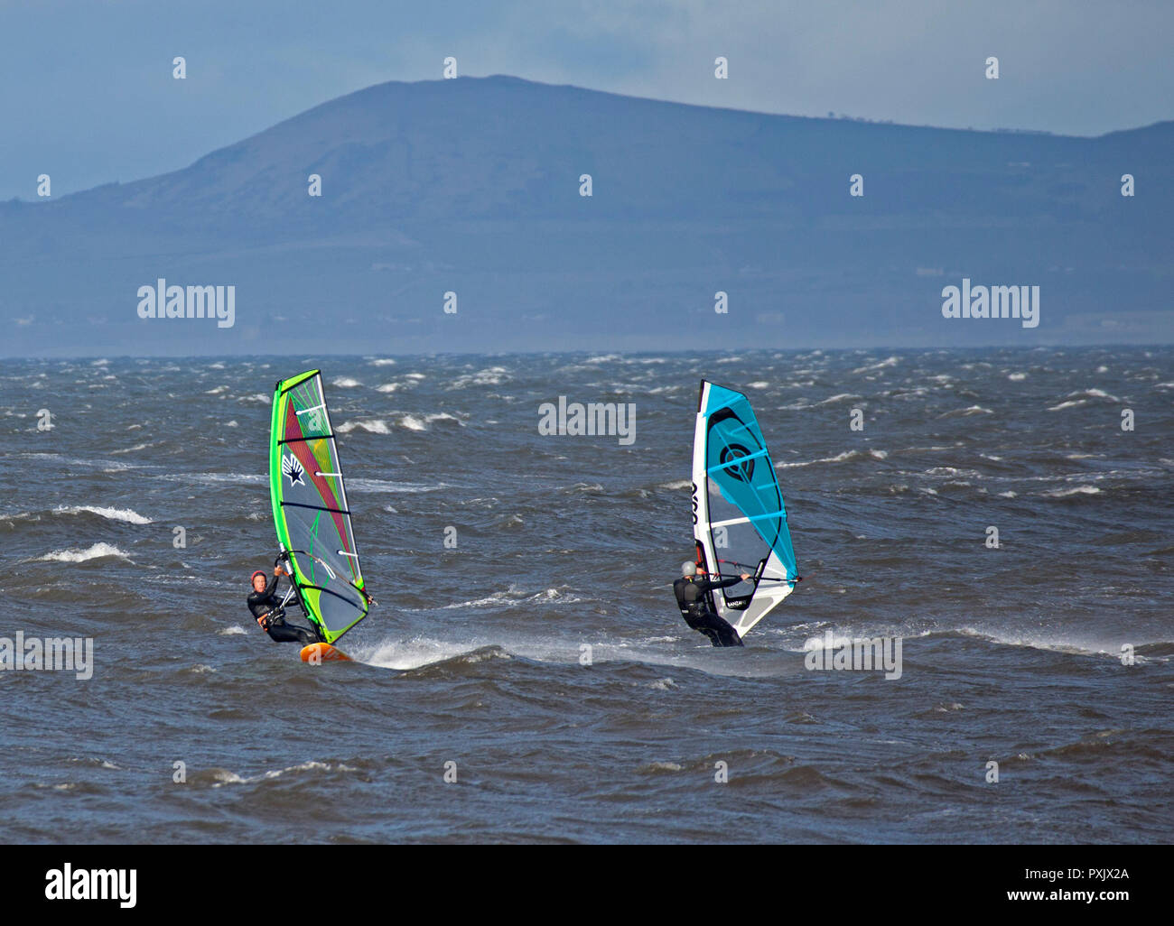 Gullane, East Lothian, Scotland, UK, 23 Oct. 2018 UK weather, 14 degrees with sunshine and winds of 44km/h and gusts of 57 km/h, windsurfers were taking advantage of the windy conditions Stock Photo