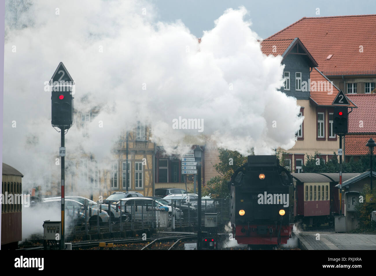 Brockengipfel, Germany. 23rd Oct, 2018. A train of the Harzer Schmalspurbahnen (HSB) pushes wagons backwards out of the station Wernigerode after the last journey. The German Weather Service (DWD) has issued a thunderstorm warning for the Harz Mountains. As a precaution, the Harz narrow-gauge railways had therefore stopped the train service to the summit of the Brocken and only drove to Drei Annen Hohne station. Credit: Klaus-Dietmar Gabbert/dpa-Zentralbild/dpa/Alamy Live News Stock Photo