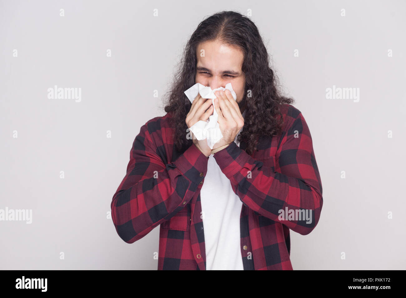 Portrait Of Cold Sick Handsome Man With Beard And Black Long Curly