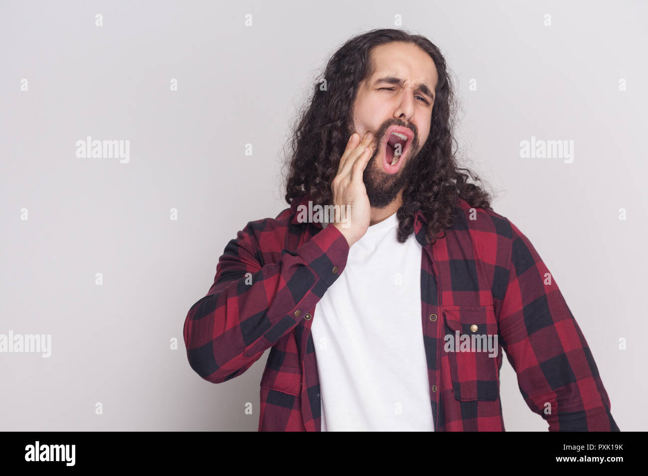 Sad Screaming Handsome Man With Beard And Black Long Curly Hair In