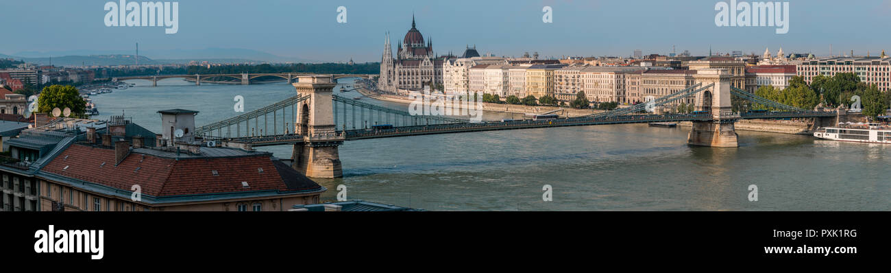 Panorama of the Chain bridge and the Hungarian parliament in the background in Budapest, Hungary. Stock Photo