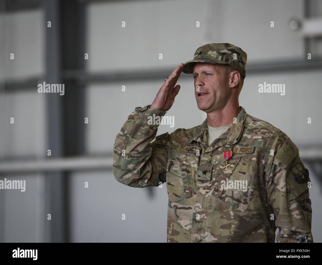 Brig. Gen. Jim Sears renders his final salute as the 455th Air Expeditionary Wing commander during a change of command ceremony at Bagram Airfield, Afghanistan, June 3, 2017. Sears commanded the 455th AEW for the last 12 months. During his time at Bagram, Sears’ leadership enabled 15,800 combat sorties, accumulating to 102,877 combat hours, which resulted in more than 1,369 kinetic strike and 2,836 enemies killed in action. Stock Photo