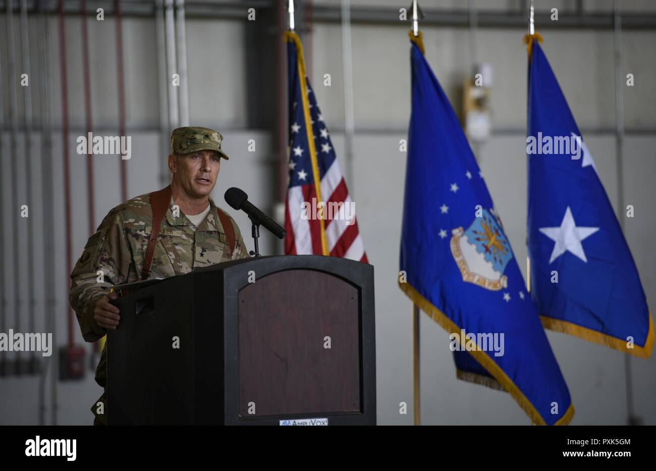 Brig. Gen. Craig Baker, the 455th Air Expeditionary Wing commander, speaks to 455th AEW Airmen and distinguished guests during a change of command ceremony at Bagram Airfield, Afghanistan, June 3, 2017. As the commander of the 455th AEW, Baker will lead the premier counterterrorism air mission in Afghanistan. The wing’s operations enable the NATO Resolute Support mission to successfully train, advise, and assist the military and security forces of Afghanistan, while restricting and deterring the terrorist threat in the region. Stock Photo