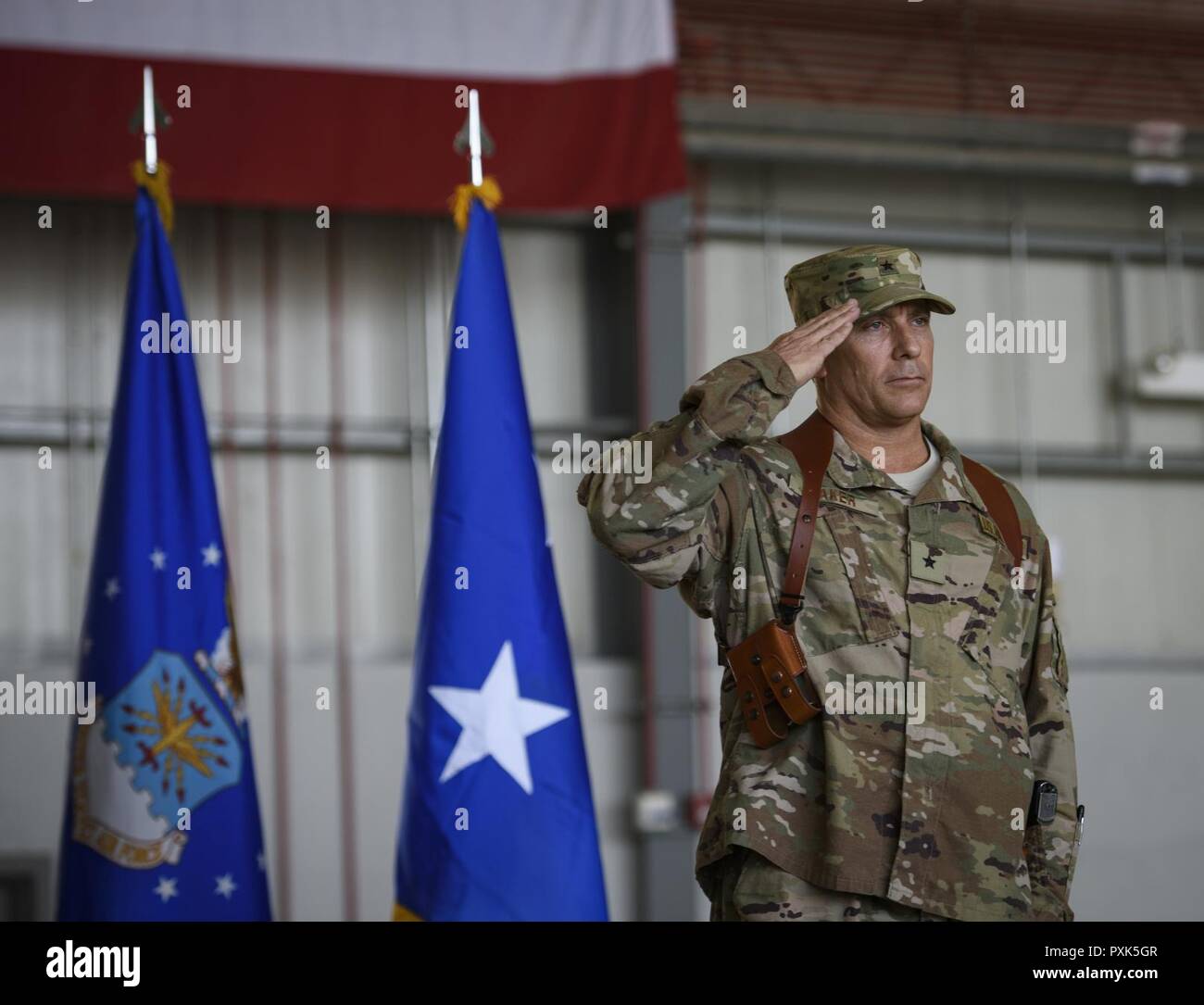 Brig. Gen. Craig Baker, the 455th Air Expeditionary Wing commander, renders his first salute to Airmen of the 455th AEW during a change of command ceremony at Bagram Airfield, Afghanistan, June 3, 2017. Baker previously served as the Director, Deputy Chief of Staff for Operations Checkmate Division at Headquarters U.S. Air Force in Washington D.C. Baker is a command pilot with more than 2,600 hours flying and has flown the F-16 Fighting Falcon and F-22 Raptor. Stock Photo