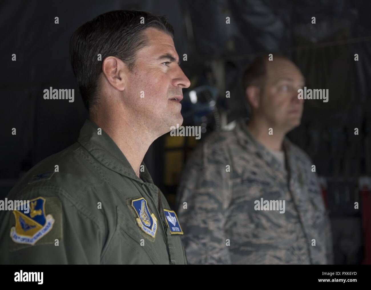 Col. Robert L. Dotson, 374th Operations commander, receives a briefing before his fine flight, June 2, 2017, at Yokota Air Base, Japan. Fini flights follow an Air Force tradition where aircrew members are met and hosed down with water by their group comrades. Stock Photo