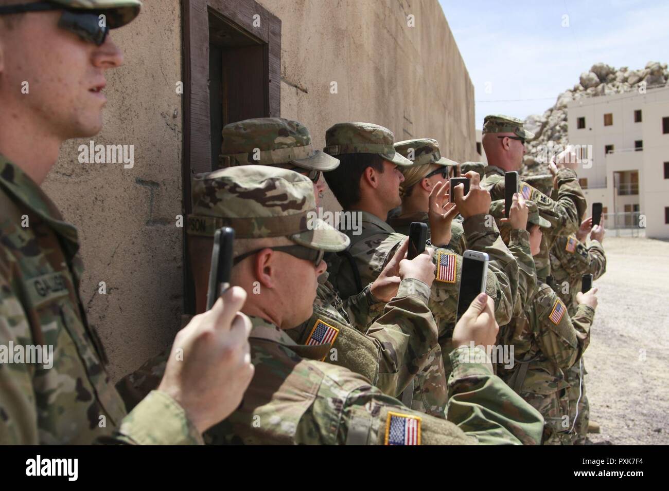 Approximately 16 Soldiers with the Topeka Recruit Sustainment Program were accompanied by Col. Roger Murdock, Kansas National Guard Chief of Staff, and cadre from the Kansas Army National Guard Recruiting and Retention Battalion, on a visit to the National Training Center at Fort Irwin, California, June 3, 2017. The purpose of the tour was to highlight the operational demand and training opportunities available with the Kansas National Guard. The visit coincided with the 2nd Combined Arms Battalion 137th Infantry Regiment; 1st Battalion, 161 Field Artillery Battalion and 772nd Mobility Augment Stock Photo