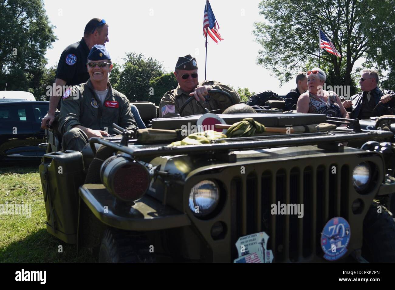 Maj. Ben Jones prepares for a ride in a WWII era Jeep following a ceremony in Picauville, France. This ceremony commemorated the 73rd anniversary of D-Day, the largest multi-national amphibious landing and operational military airdrop in history, and highlights the U.S.' steadfast commitment to European allies and partners. Overall, approximately 400 U.S. service members from units in Europe and the U.S. are participating in ceremonial D-Day events from May 31 to June 7, 2017 Stock Photo