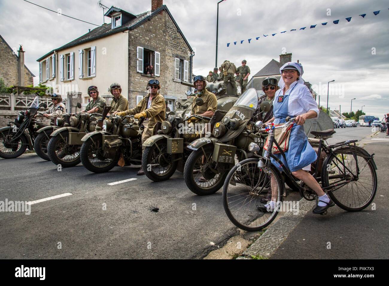 WWII re-enactors gather together for D-Day 73 celebrations in St. Mere-Eglise, France. Stock Photo