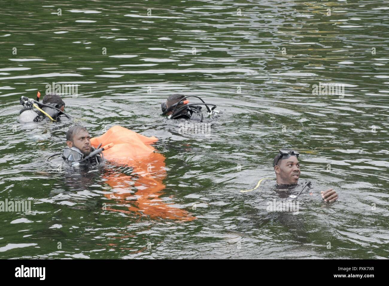 PORT OF SPAIN, Trinidad - Caribbean divers recover the simulated body during the evidence recovery dive training at Exercise TRADEWINDS 17 in Chaguaramas, Trinidad on June 5, 2017. (Canadian Forces Combat Camera Stock Photo
