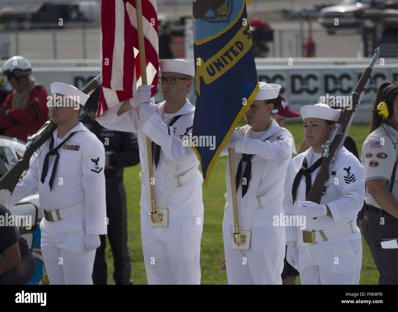 Millington, TN (June 03, 2017) Color guard members stationed onboard NSA Mid-South carry colors before the national anthem at the start of the NASCAR race at Memphis International Raceway. Stock Photo