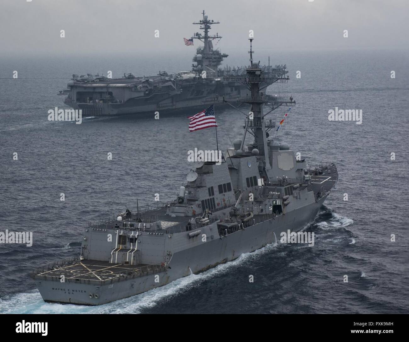 SEA OF JAPAN (June 1, 2017) The Carl Vinson Carrier Strike Group, including the aircraft carrier USS Carl Vinson (CVN 70), Carrier Air Wing (CVW) 2, the guided-missile cruiser USS Lake Champlain (CG 57) and the guided-missile destroyers USS Wayne E. Meyer (DDG 108) and USS Michael Murphy (DDG 112), operates with the Ronald Reagan Carrier Strike Group, including USS Ronald Reagan (CVN 76), CVW-5, USS Shiloh (CG 67), USS Barry (DDG 52), USS McCampbell (DDG 85), USS Fitzgerald (DDG 62) and USS Mustin (DDG 89), and the Japan Maritime Self-Defense Force ships (JS) Hyuga (DDH 181) and JS Ashigara (D Stock Photo