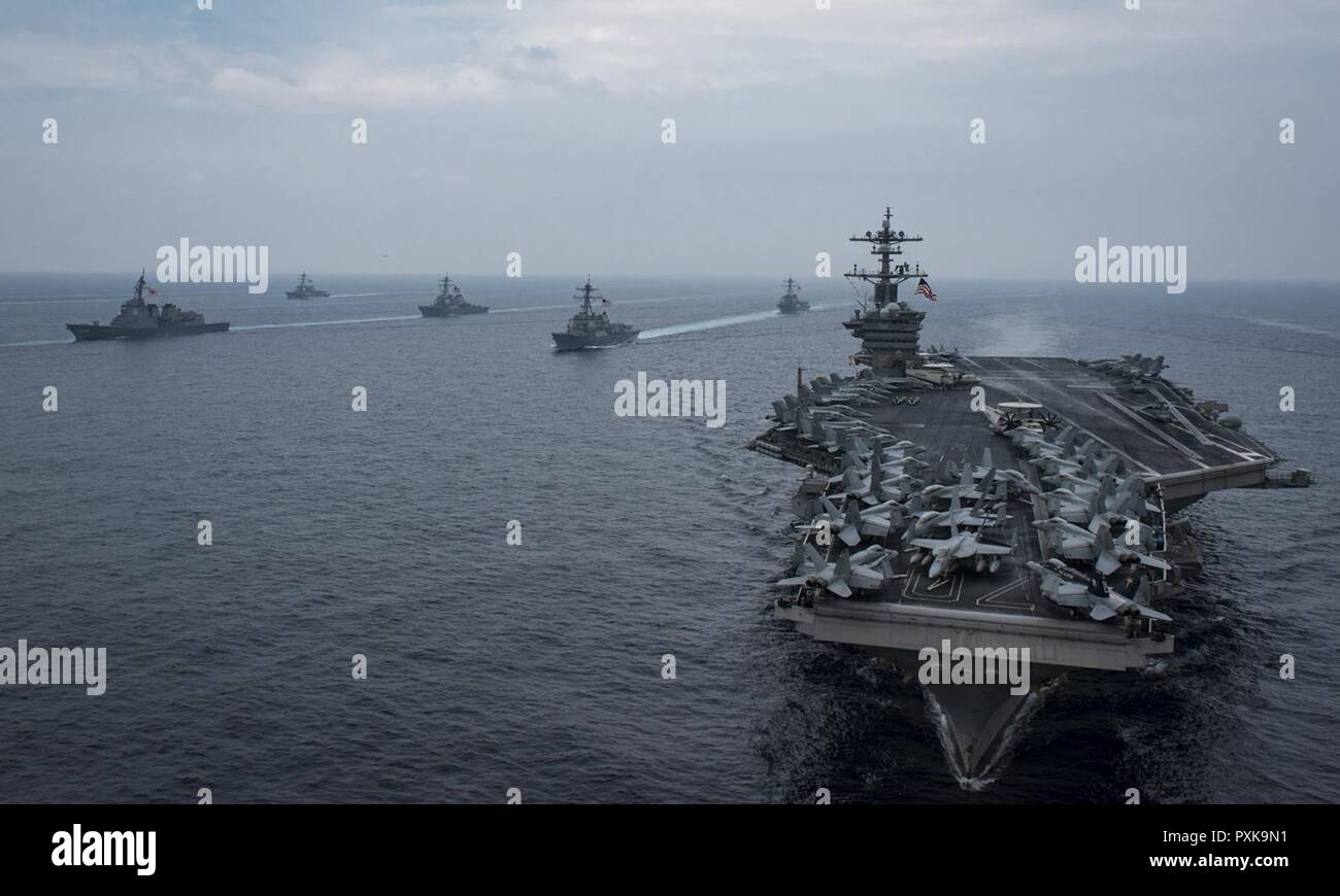 SEA OF JAPAN (June 1, 2017) The Carl Vinson Carrier Strike Group, including the aircraft carrier USS Carl Vinson (CVN 70), Carrier Air Wing (CVW) 2, the guided-missile cruiser USS Lake Champlain (CG 57) and the guided-missile destroyers USS Wayne E. Meyer (DDG 108) and USS Michael Murphy (DDG 112), operates with the Ronald Reagan Carrier Strike Group, including USS Ronald Reagan (CVN 76), CVW-5, USS Shiloh (CG 67), USS Barry (DDG 52), USS McCampbell (DDG 85), USS Fitzgerald (DDG 62) and USS Mustin (DDG 89), and the Japan Maritime Self-Defense Force ships (JS) Hyuga (DDH 181) and JS Ashigara (D Stock Photo