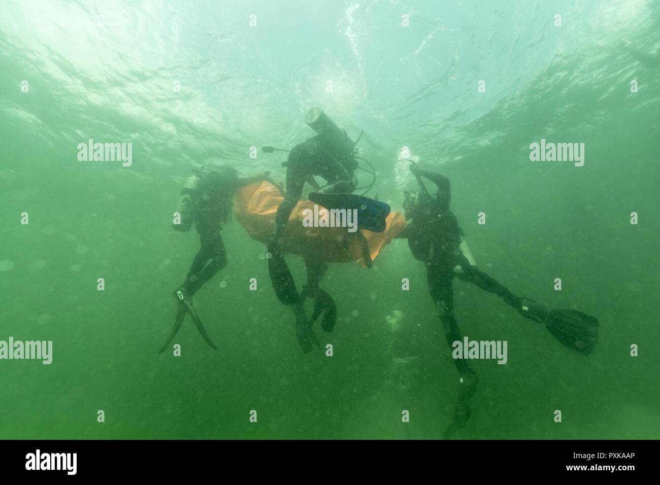 PORT OF SPAIN, Trinidad - Caribbean divers practice to recover a simulated body during Exercise TRADEWINDS 17 in Chaguaramas, Trinidad and Tobago on June 4, 2017.  (Canadian Forces Combat Camera Stock Photo