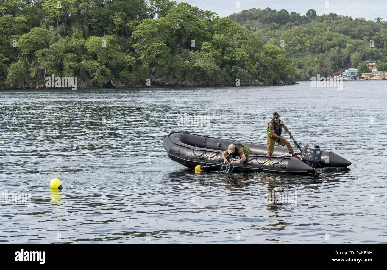 PORT OF SPAIN, Trinidad - Canadian Armed Forces divers install the jackstay for training purposes during Exercise TRADEWINDS 17 in Chaguaramas, Trinidad and Tobago on June 2, 2017. (Canadian Forces Combat Camera Stock Photo