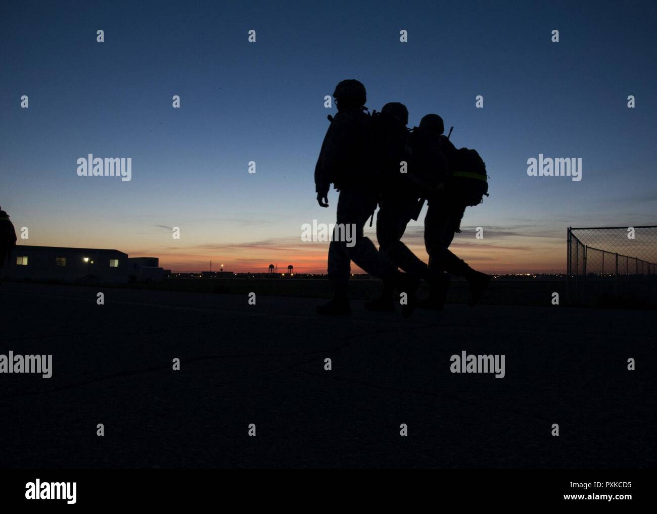 Airmen from the 5th Civil Engineer Squadron participate in a 10K ruck ...